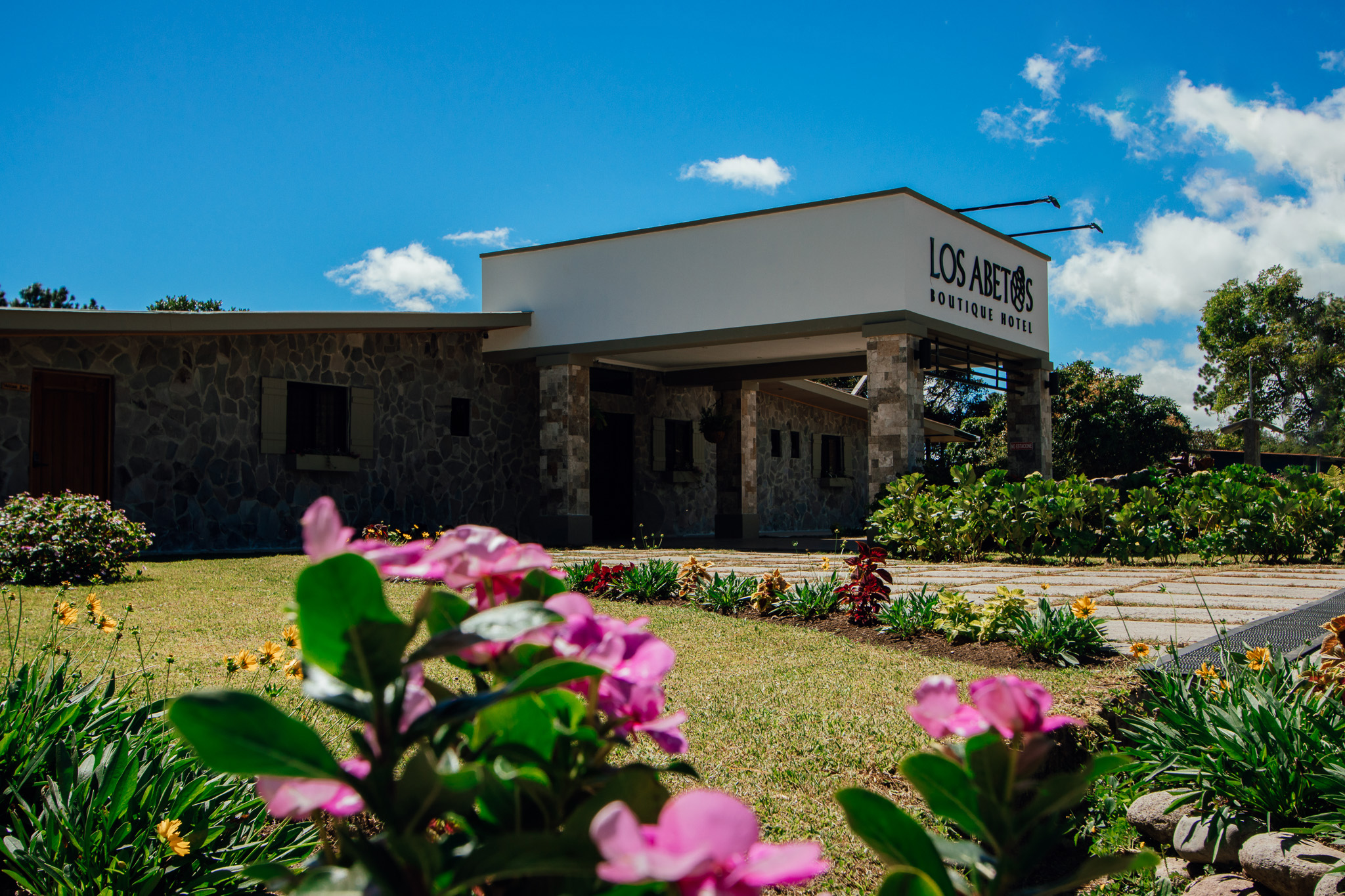 Main facade of Los Abetos Boutique Hotel in Boquete, a boutique hotel surrounded by nature with an elegant and cozy design.